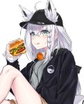  1girl ahoge animal_ear_fluff animal_ears black_hoodie blush braid burger ckhd commentary_request earrings ears_through_headwear extra_ears food fox_ears fox_girl green_eyes grey_shirt hair_between_eyes hat headphones headphones_around_neck highres holding holding_food hololive hood hoodie jewelry knee_up long_hair looking_at_viewer open_clothes open_hoodie peaked_cap shirakami_fubuki shirt sidelocks simple_background single_braid sitting solo tongue tongue_out virtual_youtuber white_background white_hair 