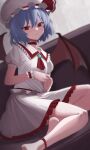  1girl absurdres ascot bat_wings blue_hair blurry brooch choker couch depth_of_field dutch_angle flat_chest hat highres jewelry looking_at_viewer mob_cap on_couch red_ribbon remilia_scarlet ribbon shin_man short_hair sitting solo touhou wings wrist_cuffs yokozuwari 