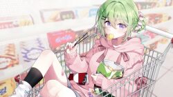  1girl absurdres alternate_costume alternate_hairstyle asymmetrical_legwear bag bag_of_chips black_socks bow box candy character_hair_ornament chico_(yuzuha_riko) chips_(food) commentary_request dabi_(15dldl15) double-parted_bangs feet_out_of_frame food food_in_mouth frilled_hoodie frills green_eyes hair_between_eyes hair_bow hair_bun hair_ornament hair_scrunchie hairclip highres holding holding_food hood hoodie in_cart indoors korean_commentary leg_warmers long_bangs long_sleeves looking_at_viewer open_bag pink_hoodie pink_scrunchie pocky potato_chips reclining red_bow scrunchie shop shopping_cart short_shorts shorts single_hair_bun sleeves_past_wrists socks solo stellive violet_eyes virtual_youtuber white_leg_warmers wrapped_candy x_hair_ornament yuzuha_riko 