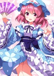  1girl :d blue_hat blue_kimono blue_ribbon blue_sash blush center_frills feet_out_of_frame folding_fan frilled_sash frilled_sleeves frills hand_fan hat highres holding holding_fan japanese_clothes kimono long_sleeves looking_at_viewer mob_cap neck_ribbon obi open_mouth pink_background pink_eyes pink_hair ribbon ribbon-trimmed_sleeves ribbon_trim ruu_(tksymkw) saigyouji_yuyuko sash short_hair smile solo standing touhou triangular_headpiece wide_sleeves 