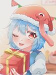  1girl blue_hair blurry blurry_background box commentary_request gift gift_box hat highres holding holding_gift kaede_(ka_e_de_03) looking_at_viewer one_eye_closed red_eyes red_headwear santa_hat short_hair short_sleeves solo tatara_kogasa tongue tongue_out touhou upper_body 