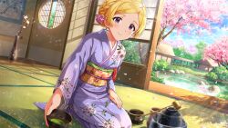  1girl blonde_hair braid card_commentary closed_mouth commentary_request cup day emily_stewart floral_print floral_print_kimono flower game_cg hair_flower hair_ornament holding holding_cup idolmaster idolmaster_million_live! idolmaster_million_live!_theater_days japanese_clothes kimono long_sleeves looking_at_viewer obi official_art print_kimono purple_kimono sash seiza short_hair sitting smile solo third-party_source tree violet_eyes 