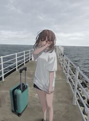  1girl absurdres bare_legs black_shorts blush brown_hair clouds cloudy_sky commentary_request hamunezuko_(nezukonezu32) hand_on_own_face highres horizon looking_at_viewer medium_hair ocean open_mouth original outdoors overcast photo_background railing rock rolling_suitcase shirt shoes shorts sky smile standing suitcase t-shirt white_shirt 