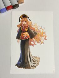  1girl art_tools_in_frame black_dress black_hat blonde_hair chinese_clothes commentary_request crescent_print dalachi_(headdress) dress full_body hat highres junko_(touhou) long_dress long_hair long_sleeves looking_at_viewer phoenix_print photo_(medium) red_eyes red_tabard shiratama_(hockey) smile solo tabard touhou traditional_media very_long_hair wide_sleeves 