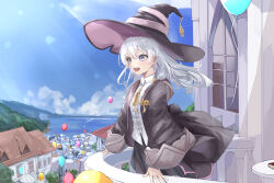  1girl absurdres balcony balloon black_hat black_robe blue_eyes blue_sky blush clouds commentary_request elaina_(majo_no_tabitabi) from_side grey_hair hair_between_eyes hand_on_railing hat highres house long_hair long_sleeves looking_to_the_side majo_no_tabitabi ocean open_mouth outdoors pink_hat robe sapota_clone sky smile solo town two-sided_fabric two-sided_headwear witch witch_hat 