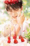  1boy birthday birthday_cake blurry bokeh brown_hair cake candle depth_of_field food hands_on_own_face highres icing jeong_taeui male_focus passion_(manhwa) ryeomiii smile solo strawberry_cake 