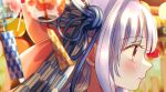  1girl blue_hair blue_ribbon blurry blurry_background blurry_foreground blush closed_mouth commentary_request festival from_side hair_ribbon highres kotonoha_aoi light_particles long_hair looking_ahead nibii_(mnwv8887) portrait print_ribbon profile red_eyes ribbon sidelocks solo tassel voiceroid wind_chime yagasuri 