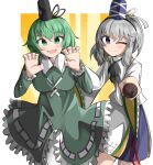  2girls :d ;) black_headwear blue_headwear blue_skirt breasts commentary dress english_commentary green_dress green_eyes green_hair grey_headwear hat highres japanese_clothes kariginu long_sleeves looking_at_viewer medium_hair mononobe_no_futo multiple_girls ofuda ofuda_on_clothes one_eye_closed orange_background pom_pom_(clothes) ribbon-trimmed_sleeves ribbon_trim short_hair sidelocks skirt smile soga_no_tojiko spam_(spamham4506) tate_eboshi touhou wide_sleeves 