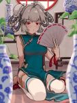  1girl aqua_dress bun_cover character_request china_dress chinese_clothes closed_mouth copyright_request double_bun dress folding_fan full_body grey_hair hair_bun hand_fan holding holding_fan indoors looking_at_viewer original red_eyes seiza short_hair sitting solo thigh-highs vase white_thighhighs yuuka_(a0240765) 