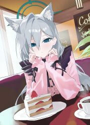  1girl absurdres alternate_costume animal_ear_fluff animal_ears blue_archive blue_eyes cafe cake cake_slice coffee commentary_request corrupted_halo cup dutch_angle elbows_on_table evening_rabbit expressionless extra_ears food green_halo grey_hair hair_between_eyes halo head_on_hands highres indoors jirai_kei long_hair mismatched_pupils pink_shirt plate pov_across_table saucer shiroko_terror_(blue_archive) shirt sleeves_past_wrists solo steam table upper_body window wolf_ears wolf_girl 