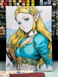  1girl art_tools_in_frame blonde_hair blue_eyes blue_shirt braid closed_mouth commentary english_commentary highres holding long_hair looking_at_viewer marker_(medium) photo_(medium) pointy_ears princess_zelda shirt signature smile solo stanley_lau the_legend_of_zelda the_legend_of_zelda:_breath_of_the_wild traditional_media upper_body 