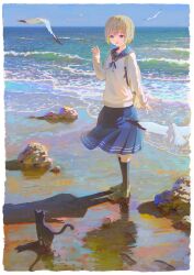 1girl :d absurdres animal backpack bag beach bird black_cat black_socks blonde_hair blue_eyes blue_sailor_collar blue_skirt border cat commentary_request feel_(nasitaki) footprints full_body green_shoes highres horizon kneehighs loafers long_sleeves medium_skirt ocean open_mouth original pleated_skirt rock sailor_collar school_uniform seagull serafuku shoes short_hair skirt sleeves_past_wrists smile socks solo standing sweater water waving white_border white_sweater 