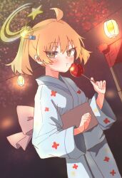  1girl ahoge alternate_costume blonde_hair blue_kimono blush bright_pupils brown_eyes candy_apple closed_mouth darknesskuruko eating food hair_ornament halo highres holding holding_food japanese_clothes kimono lantern long_sleeves looking_at_viewer night obi original outdoors sash solo summer_festival twintails wide_sleeves yellow_halo yukata 