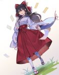  1girl alternate_costume black_hair bow dutch_angle falken_(yutozin) hair_bow hair_tubes hakama hakama_short_skirt hakama_skirt hakurei_reimu highres japanese_clothes long_hair looking_at_viewer low-tied_long_hair miko ofuda open_mouth photoshop_(medium) red_bow red_hakama red_skirt revision ribbon-trimmed_sleeves ribbon_trim skirt skirt_hold solo tabi touhou wide_sleeves yellow_eyes 