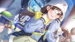  1girl bag bespectacled blurry blurry_background blush brown_hair bucket_hat dutch_angle falling_leaves glasses hat holding holding_bag idolmaster idolmaster_shiny_colors jacket leaf letterman_jacket looking_at_viewer official_art outdoors people plastic_bag red_eyes solo_focus sonoda_chiyoko twintails 