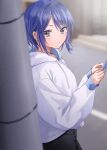  1girl absurdres akira_(jitsuimo) black_pants blue_hair blurry blurry_background blush cellphone chigusa_minori commentary_request highres holding holding_phone hood hoodie jitsu_wa_imouto_deshita. long_sleeves looking_at_viewer looking_to_the_side outdoors pants parted_lips phone second-party_source short_hair smartphone solo utility_pole violet_eyes white_hoodie 