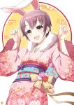  1girl animal_ears bow brown_eyes brown_hair dot_nose egasumi floral_print highres idolmaster idolmaster_cinderella_girls japanese_clothes kanji kimono obi ookami_maito open_mouth otokura_yuuki pink_kimono purple_bow rabbit_ears sash short_hair solo wide_sleeves 