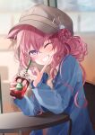  1girl absurdres animal_ears cabbie_hat casual cup disposable_cup drinking_straw grin hakui_koyori hat highres hololive iced_coffee lllconfidential long_hair looking_at_viewer one_eye_closed pink_hair smile solo table violet_eyes virtual_youtuber wolf_ears wolf_girl 