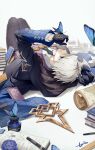  1boy absurdres air_(ai_r_) black_eyes black_gloves bug butterfly butterfly_on_hand checkered_necktie fate/grand_order fate_(series) gloves grey_hair highres inkwell james_moriarty_(ruler)_(fate) lightning_ahoge lying male_focus map necktie on_back pants pen puzzle_piece_print ruler signature striped striped_pants textbook 