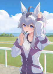  1girl absurdres ahoge animal_ears blue_eyes blush breasts closed_mouth collarbone commentary_request ear_ornament grey_hair gym_shirt hair_between_eyes highres horse_ears horse_girl jacket kasamatsu_tracen_training_uniform long_hair long_sleeves multicolored_hair multicolored_jacket oguri_cap_(umamusume) outdoors pants ponytail purple_jacket purple_pants purple_track_suit shirt sky solo track_jacket track_pants track_suit two-tone_jacket tying_hair umamusume umamusume:_cinderella_gray white_shirt yuzpoi 