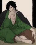  1boy aramaki_(ryokugyu) bake_ryori barefoot black_coat black_hair chest_tattoo cigarette coat covering_mouth crossed_legs curly_hair green_kimono hair_over_one_eye highres holding holding_cigarette indoors japanese_clothes kimono male_focus one_piece short_hair sitting sketch smoking stomach_tattoo tattoo 