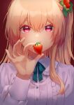  1girl blonde_hair blue_ribbon breasts collared_shirt covered_mouth crossed_bangs food food-themed_hair_ornament fruit hair_between_eyes hair_ornament hand_up harecaba holding holding_food leaf long_hair long_sleeves medium_breasts neck_ribbon original portrait red_background red_eyes ribbon shirt solo strawberry strawberry_hair_ornament white_shirt 