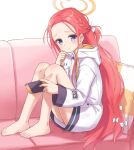  bare_legs barefoot blue_archive blue_eyes blush couch feet hair_ribbon halo handheld_game_console highres holding holding_handheld_game_console knees_up long_hair long_sleeves looking_at_viewer machikado no_shoes on_couch pillow redhead ribbon sitting very_long_hair yuzu_(blue_archive) 