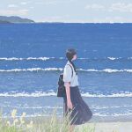  1girl arms_at_sides backpack bag black_hair blue_skirt blue_sky boat braid braided_ponytail clouds collared_shirt facing_away faux_traditional_media feet_out_of_frame flower from_side grass hair_behind_ear hayashi_naoyuki highres horizon landscape long_hair long_skirt mountain nature ocean original pleated_skirt scenery school_uniform shirt shirt_tucked_in shore short_sleeves skirt sky solo standing water watercraft white_shirt yellow_flower 