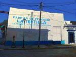  1other angelasungart blue_sky building door entrance graffiti highres original path power_lines road scenery shadow sky spanish_text street sunlight utility_pole 