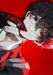  1boy amamiya_ren black-framed_eyewear black_eyes black_hair black_jacket calling_card glasses hair_between_eyes heterochromia highres holding jacket long_sleeves male_focus persona persona_5 portrait red_background red_eyes school_uniform sideways simple_background solo syu_raii twitter_username 