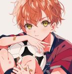  1boy aged_down ball bandaid bandaid_on_arm bandaid_on_leg closed_mouth commentary fingernails gg_suyari green_eyes male_child male_focus orange_eyes project_sekai scrape shinonome_akito short_hair short_sleeves simple_background soccer_ball solo 