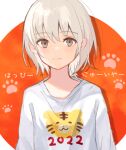  1girl 2022 animal_print brown_eyes chinese_zodiac grey_hair looking_at_viewer nengajou new_year original paw_print short_hair smile solo tiger_print touchika upper_body year_of_the_tiger 