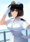  1girl black_hair brown_eyes buttons closed_mouth gloves haguro_(kancolle) hair_between_eyes hat kantai_collection military_uniform naval_uniform peaked_cap short_hair short_sleeves smile solo tomoyo_kai uniform upper_body white_gloves white_headwear 