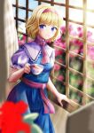  1girl alice_margatroid ascot blonde_hair blue_dress blue_eyes blurry blurry_foreground capelet cup dress flower hairband highres holding holding_cup indoors kyabekko looking_at_viewer puffy_short_sleeves puffy_sleeves red_ascot short_sleeves smile solo touhou wavy_hair white_capelet window 
