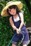  1girl :d absurdres bare_shoulders black_hair blue_overalls blurry blush brown_eyes cowboy_shot day denim depth_of_field hat highres holding holding_hose hose looking_at_viewer matsunaga_kouyou nose_blush open_mouth original outdoors overall_shorts overalls parted_bangs shirt short_hair smile solo standing straw_hat teeth thick_eyebrows upper_teeth_only vegetation 