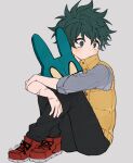  1boy alternate_costume black_pants boku_no_hero_academia closed_mouth coi_mha freckles green_hair grey_background grey_shirt knees_up long_sleeves looking_to_the_side male_focus midoriya_izuku orange_vest pants red_footwear scar scar_on_arm shirt simple_background sitting sleeves_past_elbows solo vest 