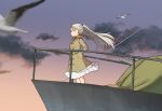  1girl annin_musou bird brown_coat brown_eyes cannon clouds coat conte_di_cavour_(kancolle) dawn dress feet_out_of_frame gradient_sky grey_hair hands_in_pockets kantai_collection long_hair long_sleeves railing seagull sky two_side_up white_dress 