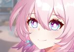  1girl blue_eyes blurry blurry_background blush close-up closed_mouth depth_of_field english_commentary hair_between_eyes highres honkai:_star_rail honkai_(series) march_7th_(honkai:_star_rail) pink_eyes pink_hair smile solo twitter_username two-tone_eyes vonn363 