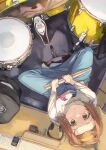  1girl brown_hair drum drum_set drumsticks forehead from_above hairband highres holding holding_drumsticks indian_style instrument k-on! looking_at_viewer looking_up otsudou shirt sitting solo tainaka_ritsu white_shirt yellow_hairband 