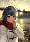  1girl adjusting_scarf artist_name blue_hair blush bridge brooklyn_bridge brown_gloves building cityscape closed_mouth coat commentary_request domestic_na_kanojo duffel_coat evening fingers gloves hand_up highres looking_at_viewer new_york outdoors plaid plaid_scarf reaching reaching_towards_viewer real_world_location red_eyes river sasuga_kei scarf scenery selfie short_hair skyscraper smile solo sun sunset tachibana_rui white_coat 