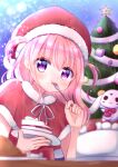  1girl blurry blurry_foreground blush cake cake_slice capelet christmas christmas_tree eating food food_on_face fork fur-trimmed_capelet fur_collar fur_trim hanasakichu hat highres holding holding_fork holding_plate long_hair looking_at_viewer neck_ribbon original pink_hair plate rabbit ribbon santa_costume santa_hat solo two_side_up upper_body violet_eyes 