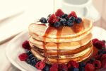  blueberry blurry blurry_background commentary_request food food_focus fruit no_humans original pancake pancake_stack plate puchira raspberry realistic still_life strawberry syrup 