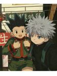  2boys backpack bag blue_eyes border child facing_viewer gon_freecss green_hair green_shorts highres hunter_x_hunter killua_zoldyck long_sleeves looking_back male_focus multiple_boys open_mouth outdoors qn_ui3 shorts spiky_hair translation_request white_border white_hair 