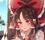  1girl ascot blush bow brown_eyes brown_hair commission cropped gohei hair_bow hair_tubes hakurei_reimu long_hair mozukuzu_(manukedori) open_mouth portrait red_bow sidelocks skeb_commission solo touhou yellow_ascot 