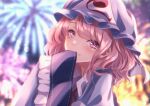  1girl blue_dress blue_headwear blurry depth_of_field dress fireworks highres lens_flare looking_at_viewer pink_eyes pink_hair saigyouji_yuyuko shiranui_(wasuresateraito) sleeves_past_fingers sleeves_past_wrists smile solo touhou 