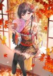  1girl arm_up autumn autumn_leaves black_hair black_thighhighs braid bush commentary_request crossed_bangs detached_sleeves floral_print flower gradient_kimono hair_flower hair_ornament hand_fan highres holding holding_fan japanese_clothes kimono leaf long_hair miwabe_sakura original paper_fan red_eyes sitting solo thigh-highs water wide_sleeves window zettai_ryouiki 