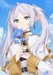  1girl asle belt black_belt blue_flower blue_sky capelet clouds earrings falling_petals flower frieren gold_trim green_eyes grey_hair highres jewelry light_smile long_sleeves petals pointy_ears sky sousou_no_frieren twintails white_capelet 