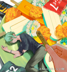  1boy amami_rantaro antenna_hair brown_pants candy commentary_request danganronpa_(series) danganronpa_v3:_killing_harmony ear_piercing earrings eyelashes flower food food_wrapper green_eyes green_hair hair_between_eyes highres holding holding_candy holding_food holding_lollipop jewelry lollipop looking_at_viewer lying male_focus mini_person multiple_rings necklace on_side orange_flower pants piercing pov pov_hands ring shirt short_hair solo_focus striped_clothes striped_shirt sukizukiko translation_request vertical-striped_sleeves white_flower 