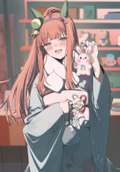  1girl :d animal_charm animal_ears aqua_eyes blunt_bangs blurry blurry_background blush charm_(object) commentary_request ear_covers emyo hair_ornament highres holding holding_charm horse_ears horse_girl japanese_clothes kimono long_hair looking_at_viewer obi open_mouth orange_hair rabbit_charm sash silence_suzuka_(umamusume) smile solo umamusume white_kimono white_sash 