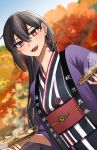  1girl alternate_costume autumn_leaves black_hair clothes_writing dutch_angle hair_between_eyes happi highres japanese_clothes kantai_collection kimono long_hair machi_(ritovoyage) nagato_(kancolle) obi open_mouth red_eyes sash smile solo striped striped_kimono teeth tree upper_body upper_teeth_only 